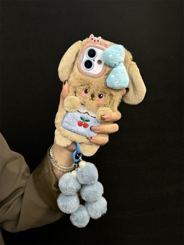 Plush Puppy Phone Case with Bow, Cherry Detail, and Blue Pom-Pom Bracelet