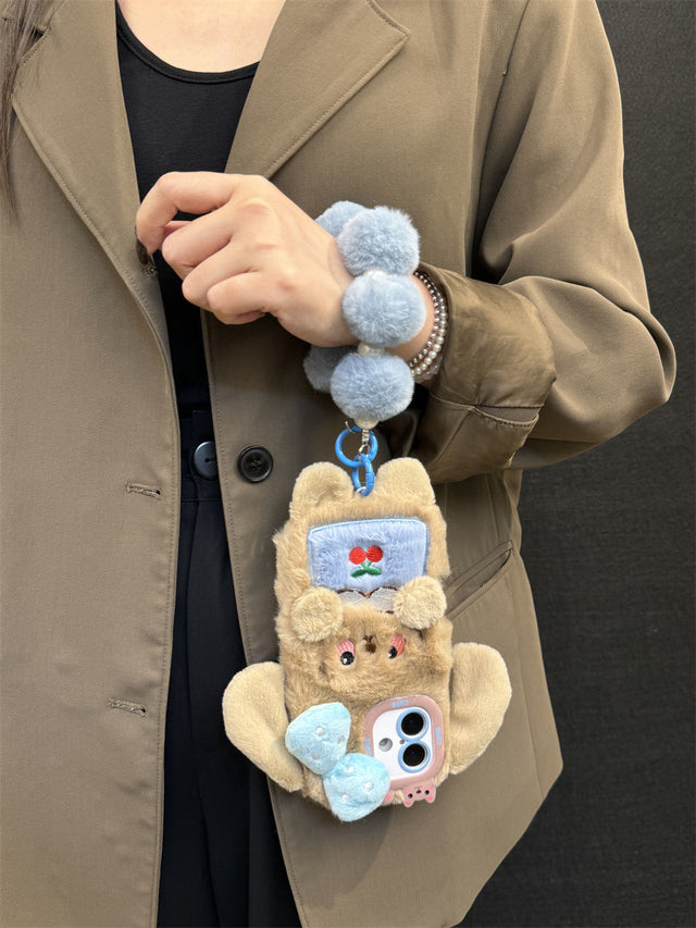 Plush Puppy Phone Case with Bow, Cherry Detail, and Blue Pom-Pom Bracelet